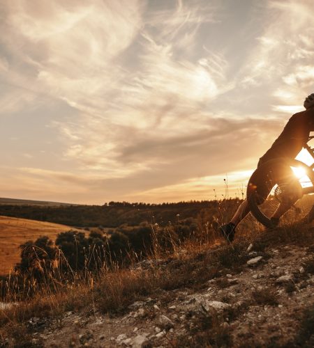 cyclist-with-mountain-bike-at-sunset.jpg